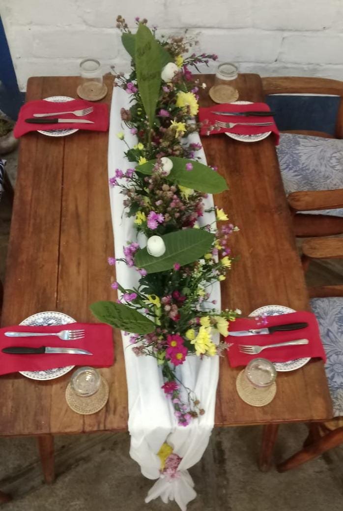 Dinner table with natural floral centerpiece