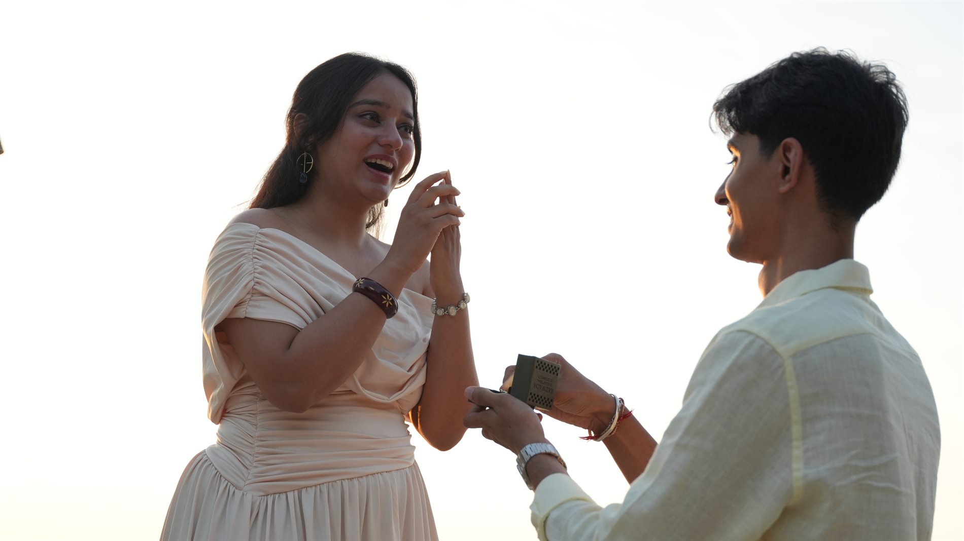 Beach proposal ring moment